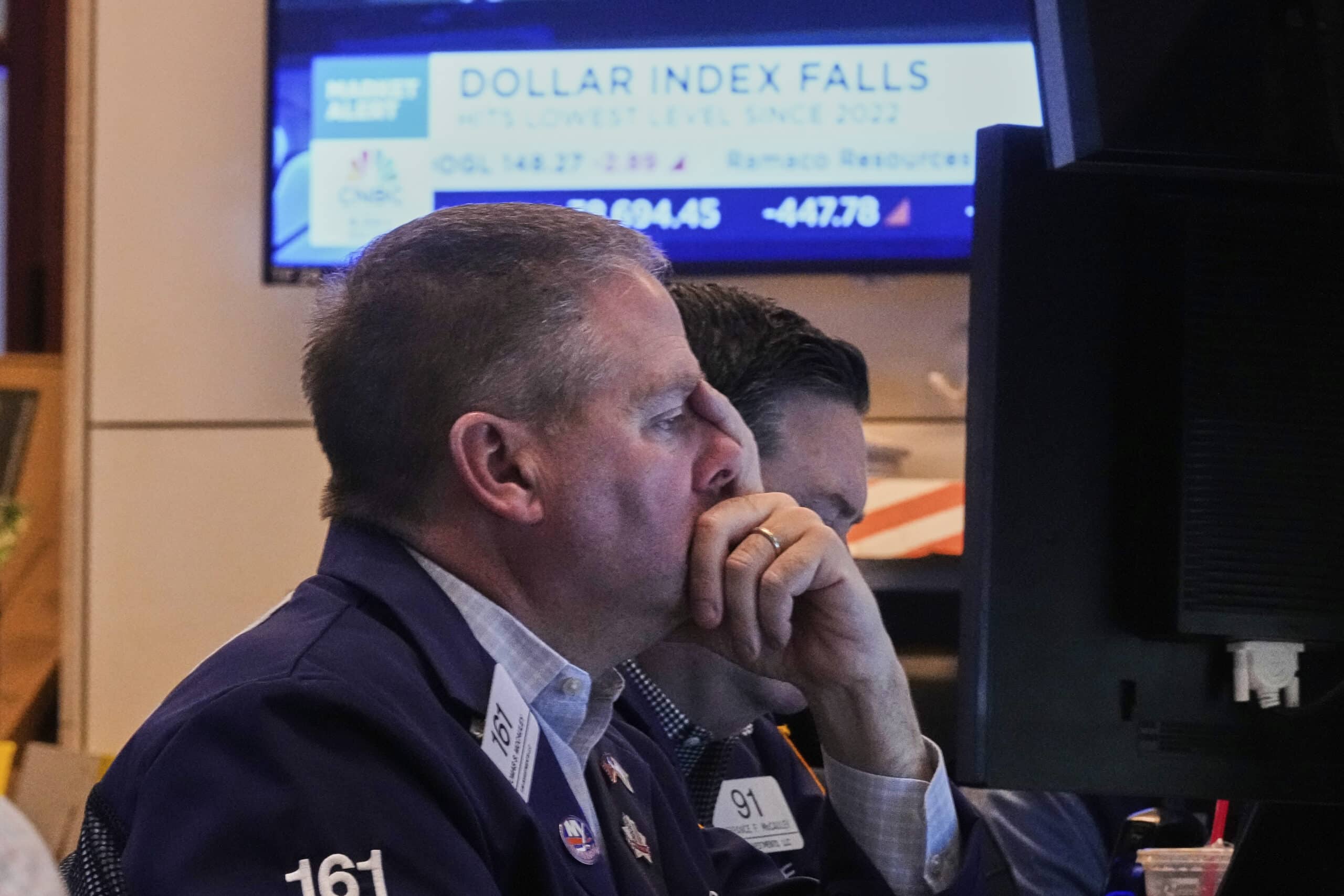 Trader Thomas McCauley works on the floor of the New York Stock Exchange