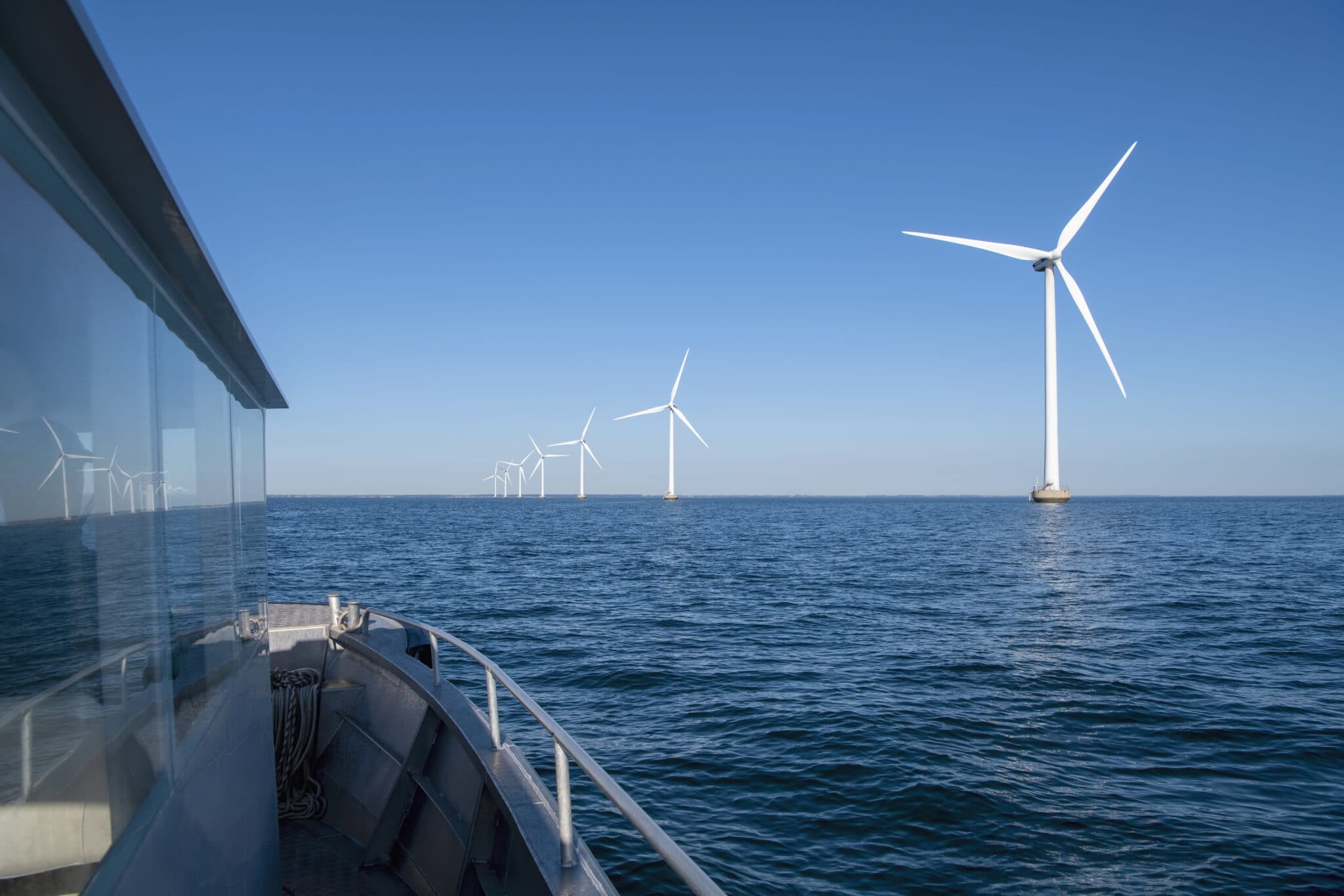 Offshore wind power turbines as seen from a boat