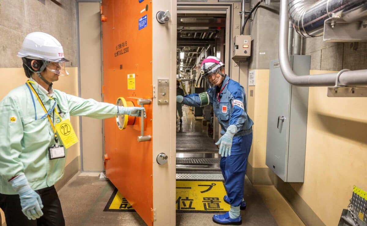 Officials at the Kashiwazaki-Kariwa nuclear power station open a watertight door inside the unit 7 reactor building at the Kashiwazaki-Kariwa nuclear power station in in Japan