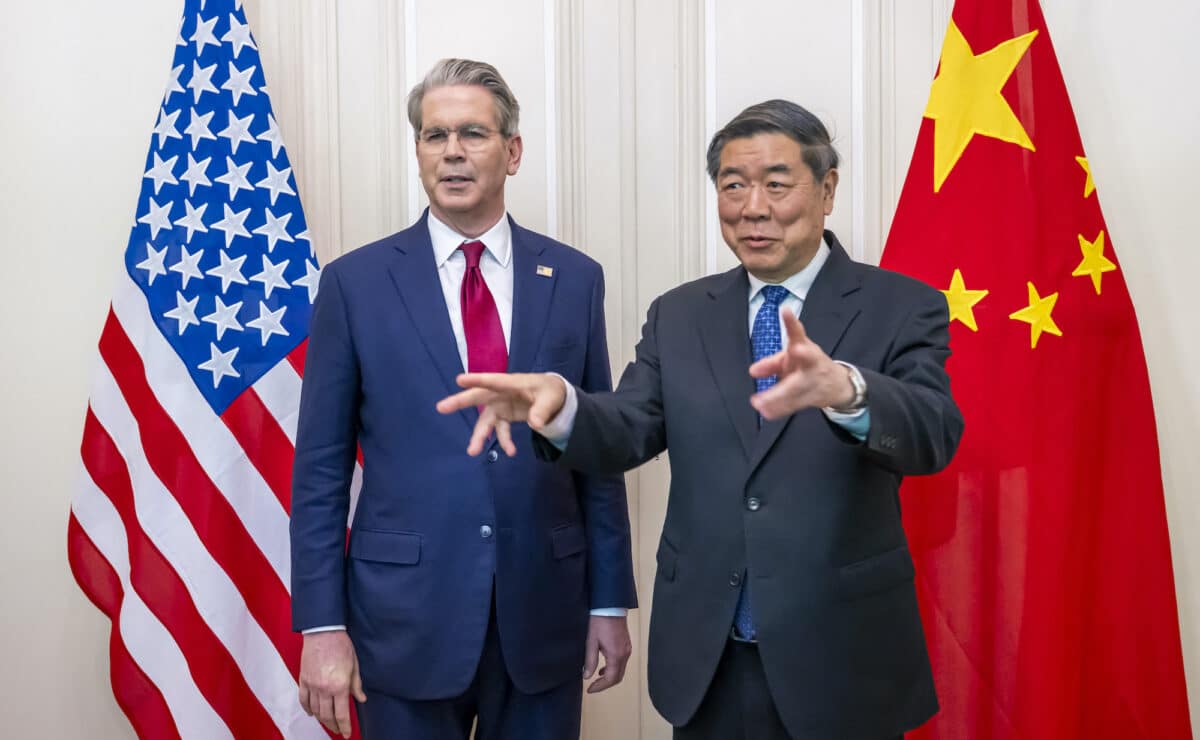 China's Vice Premier He Lifeng (R) gestures next to US Treasury Secretary Scott Bessent